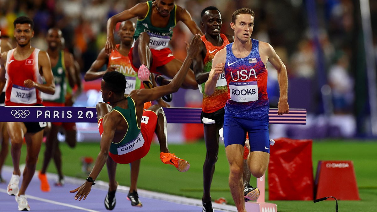 Medics rush to help Olympic athlete Lamecha Girma after terrifying fall in the men’s steeplechase in…