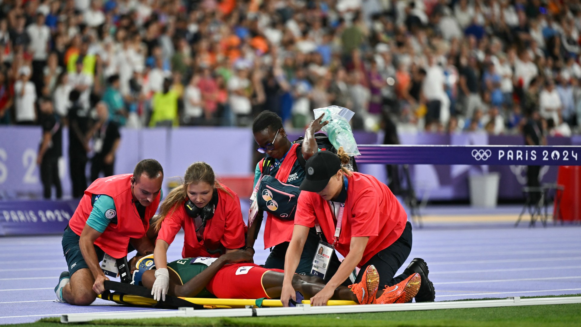 World record holder Lamecha Girma leaves Olympic track on stretcher following terrifying fall in…