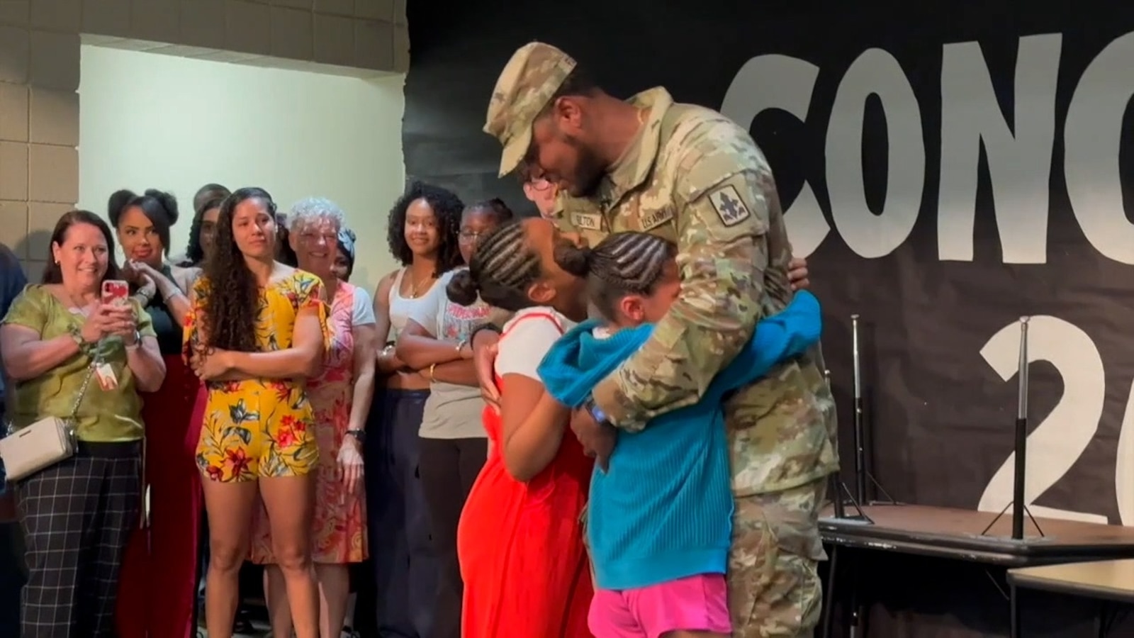 Army dad surprises daughters at school assembly in emotional reunion